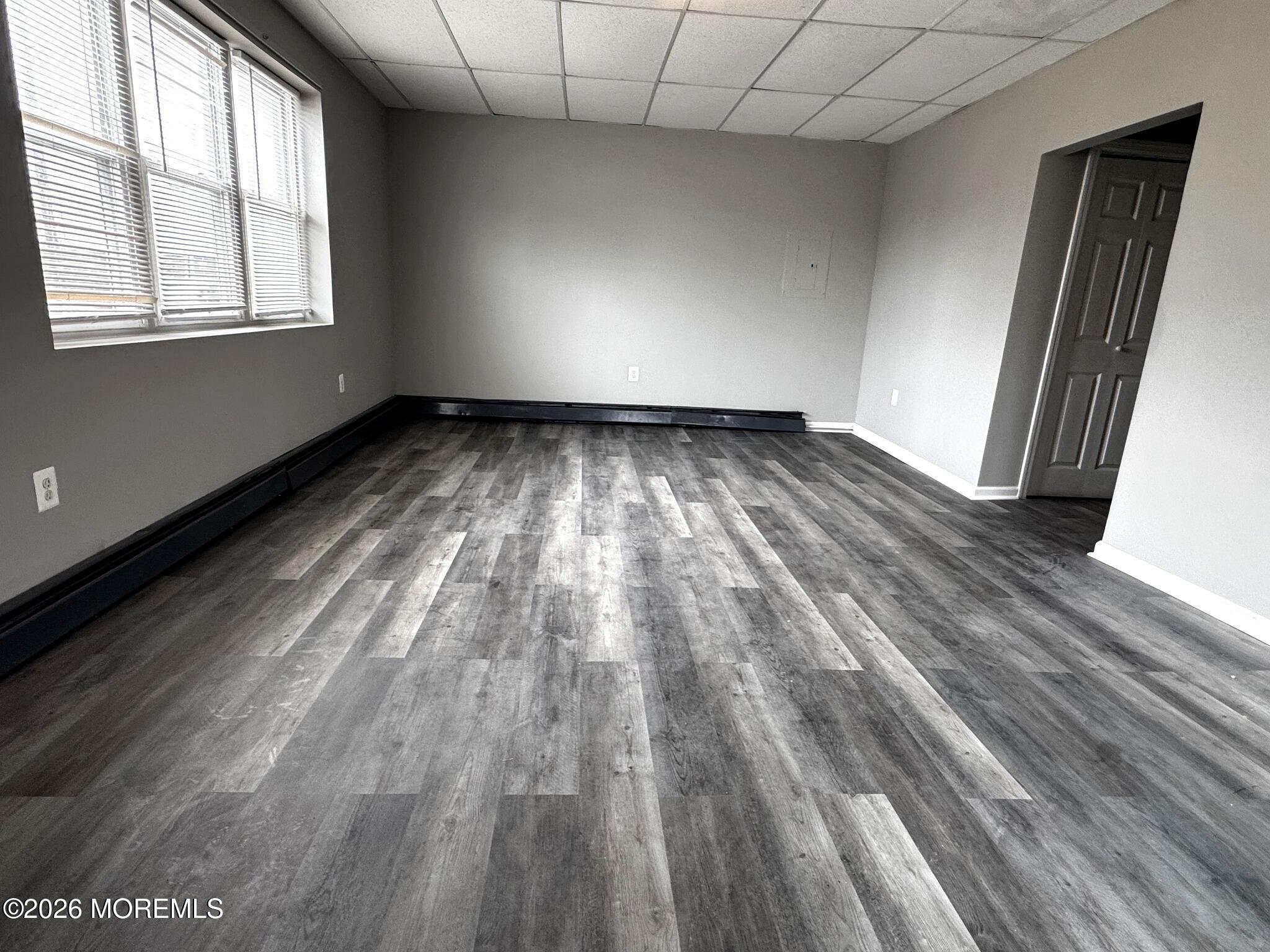 1830 East Riverside Drive Atlantic City, NJ 08401 - Photo 9 of 41 wooden floor in an empty room with a window