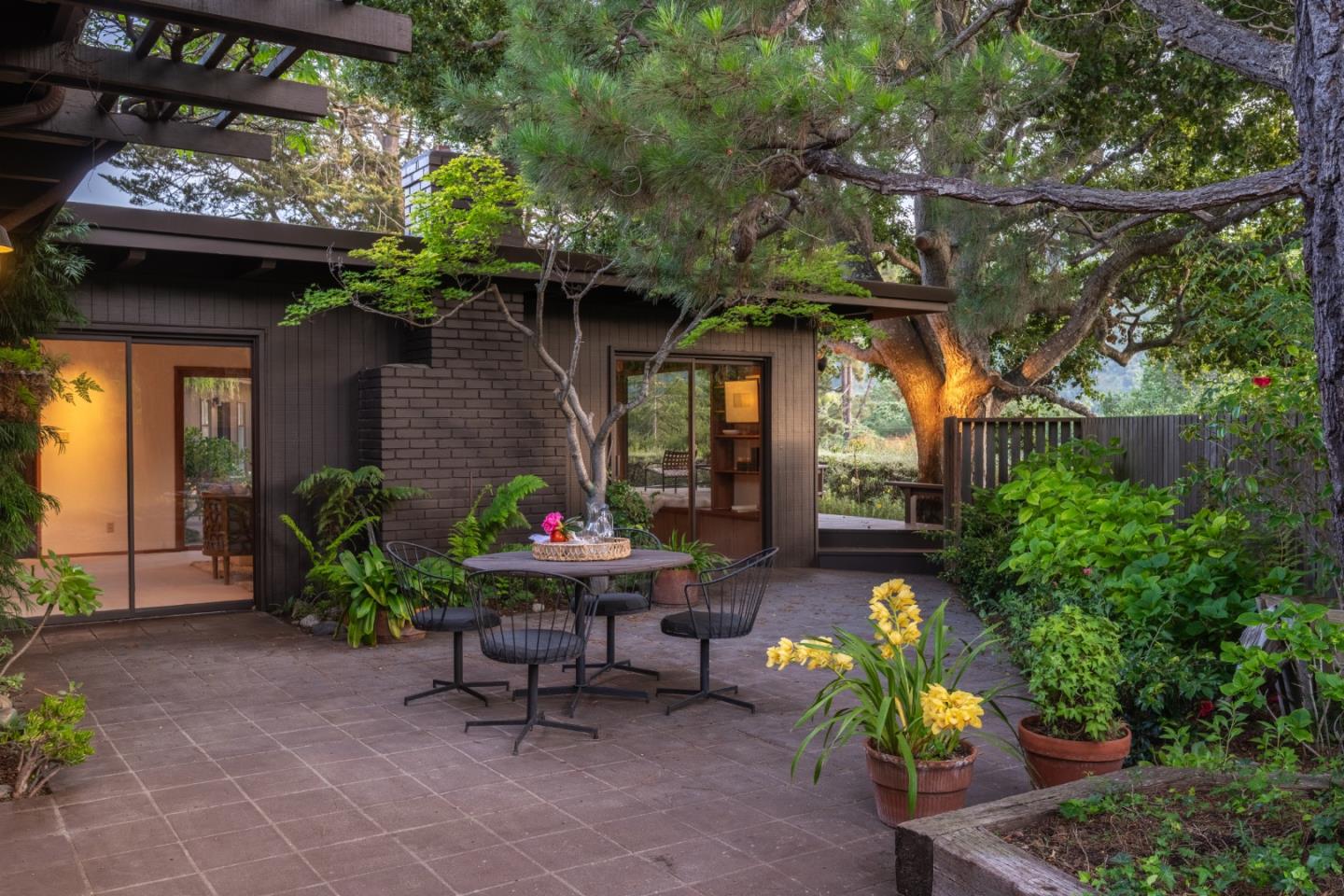 46 Middle Canyon Road Carmel Valley, CA 93924 - Photo 50 of 74 a view of a chair and table in backyard of the house