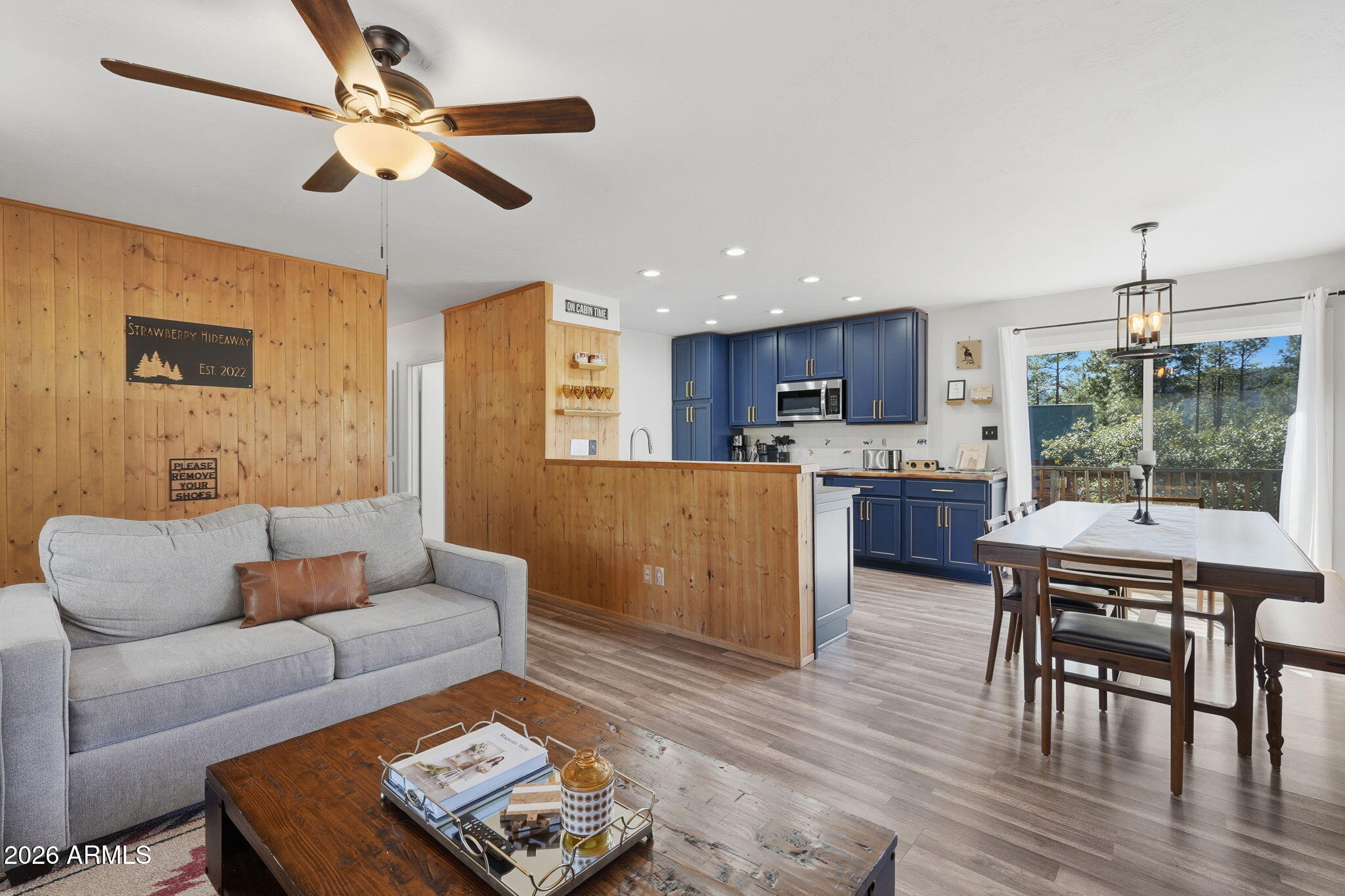 8247 Ralls Drive Pine, AZ 85544 - Photo 7 of 50 a living room with furniture and a wooden floor