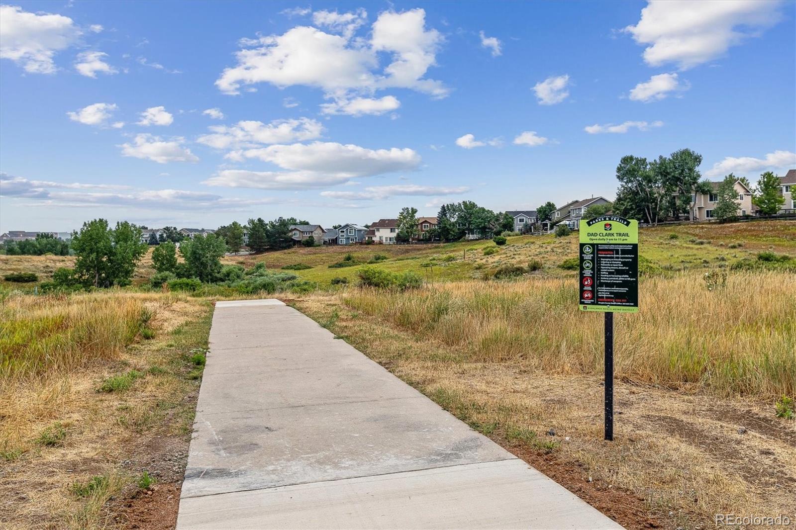 2891 Canyon Crest Drive Highlands Ranch, CO 80126 - Photo 36 of 41 a view of a lake with a yard
