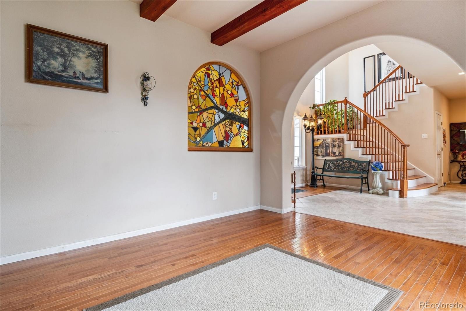 2891 Canyon Crest Drive Highlands Ranch, CO 80126 - Photo 10 of 41 a view of an entryway with wooden floor