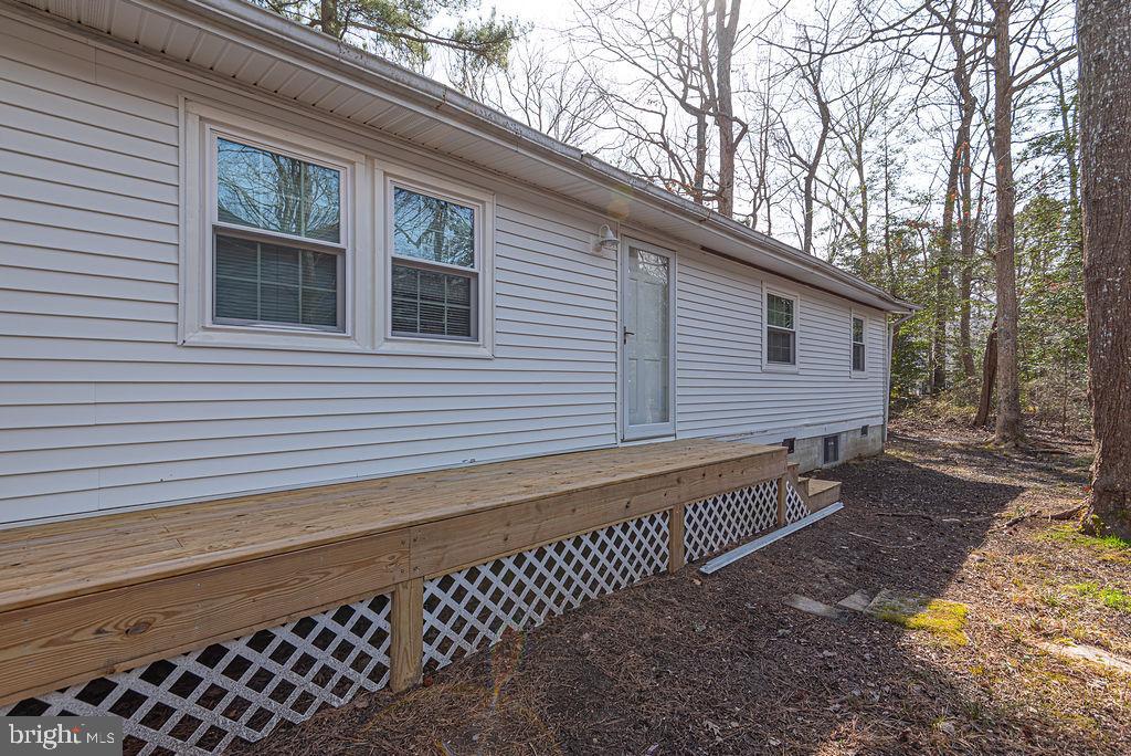 757 Ocean Parkway Ocean Pines, MD 21811 - Photo 12 of 29 a view of a house with a yard