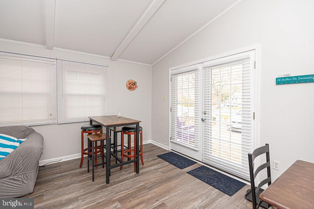 757 Ocean Parkway Ocean Pines, MD 21811 - Photo 15 of 29 a view of a dining room with furniture window and wooden floor