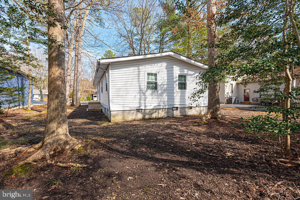 757 Ocean Parkway Ocean Pines, MD 21811 - Photo 2 of 29 a view of a house with a yard