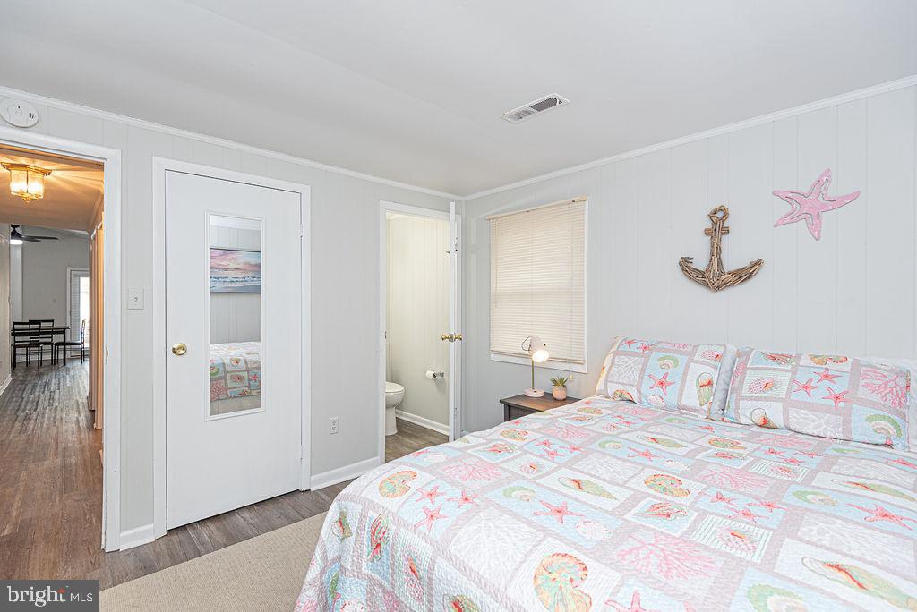 757 Ocean Parkway Ocean Pines, MD 21811 - Photo 29 of 29 a bedroom with a bed and a cabinets