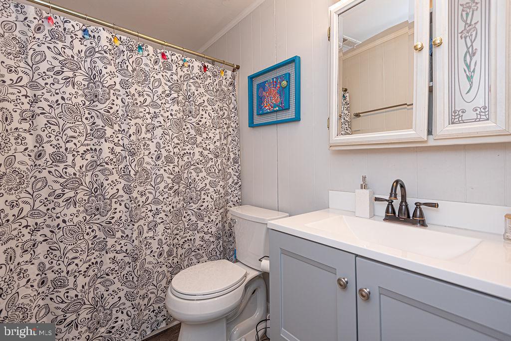 757 Ocean Parkway Ocean Pines, MD 21811 - Photo 3 of 29 a bathroom with a sink and a toilet
