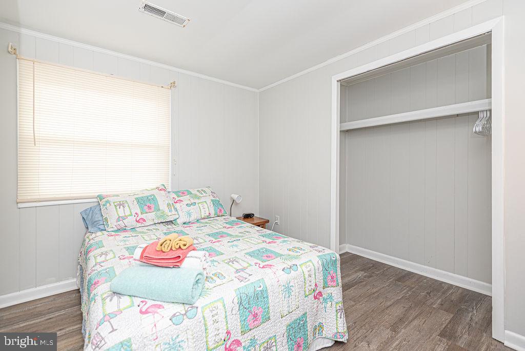 757 Ocean Parkway Ocean Pines, MD 21811 - Photo 7 of 29 a bedroom with a bed and a window