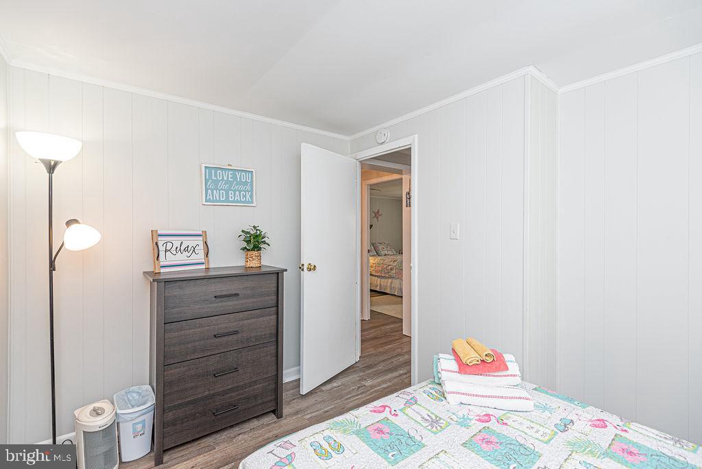 757 Ocean Parkway Ocean Pines, MD 21811 - Photo 8 of 29 a bedroom with a bed and a dresser