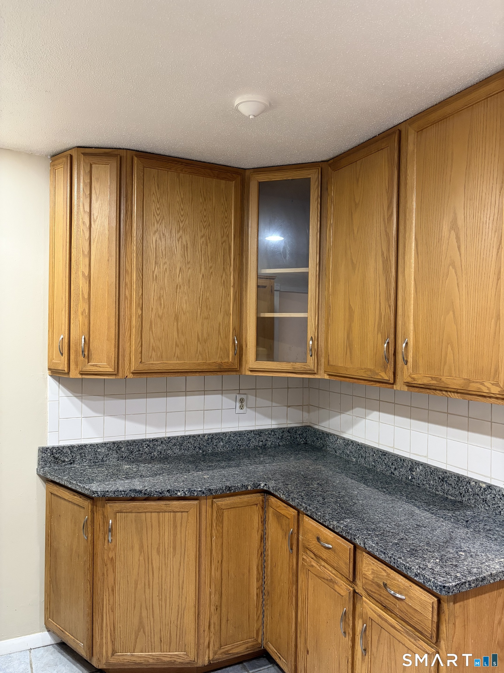 166 Old Brookfield Road, Unit 20B1 Danbury, CT 06811 - Photo 18 of 30 a view of a kitchen with granite countertop cabinets