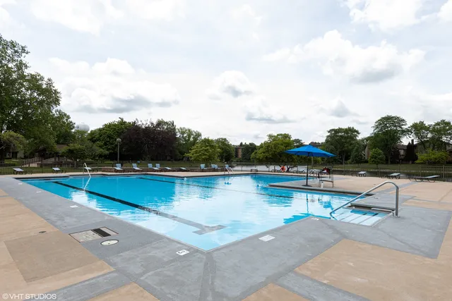 a view of a swimming pool with lounge chair