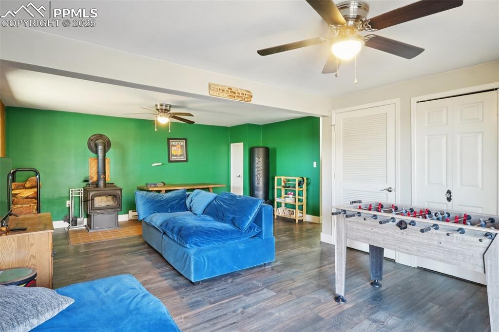 975 Crystal Park Road Manitou Springs, CO 80829 - Photo 29 of 38 a living room with furniture and wooden floor