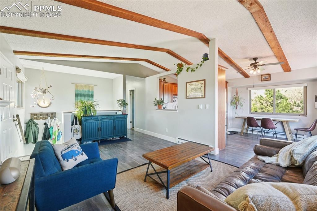975 Crystal Park Road Manitou Springs, CO 80829 - Photo 5 of 38 a living room with furniture a rug and a window