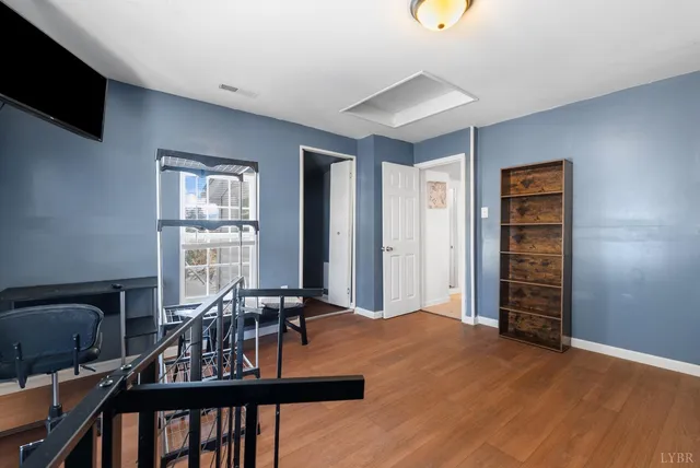 a walk in closet with a couch