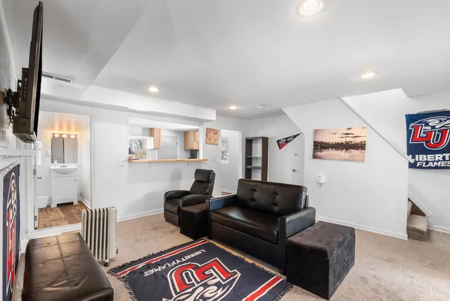 a view of a white house with a yard