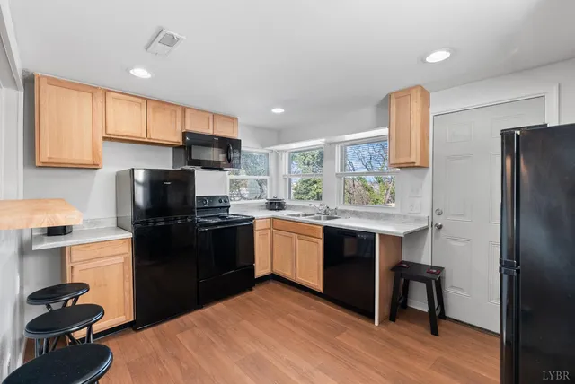 a bathroom with a sink toilet and a mirror