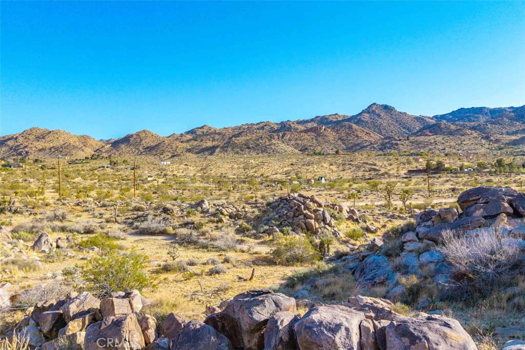 62570 Turtle Road Joshua Tree, CA 92252 - Photo 11 of 22 a view of a city with mountains in the background