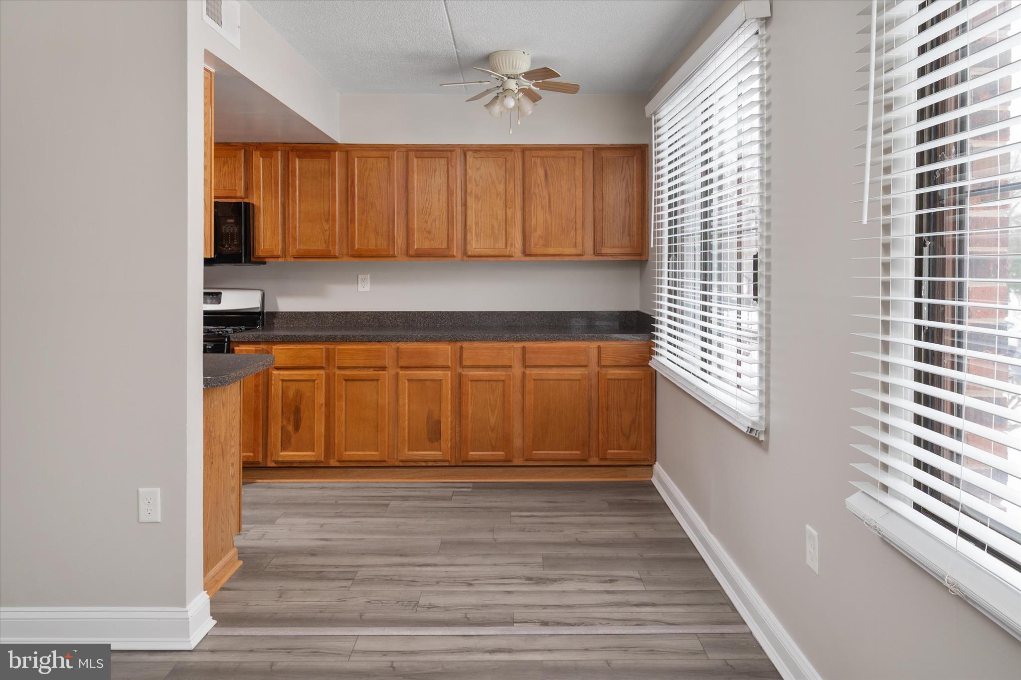 5245 West Running Brook Road, Unit 101 Columbia, MD 21044 - Photo 14 of 33 a view of a kitchen with a sink and cabinets