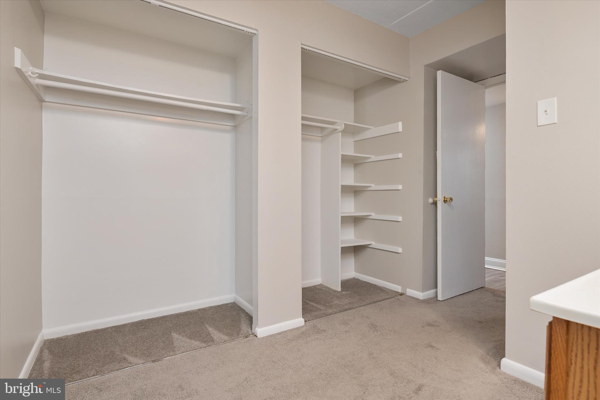 5245 West Running Brook Road, Unit 101 Columbia, MD 21044 - Photo 19 of 33 a view of an empty room and a walk in closet