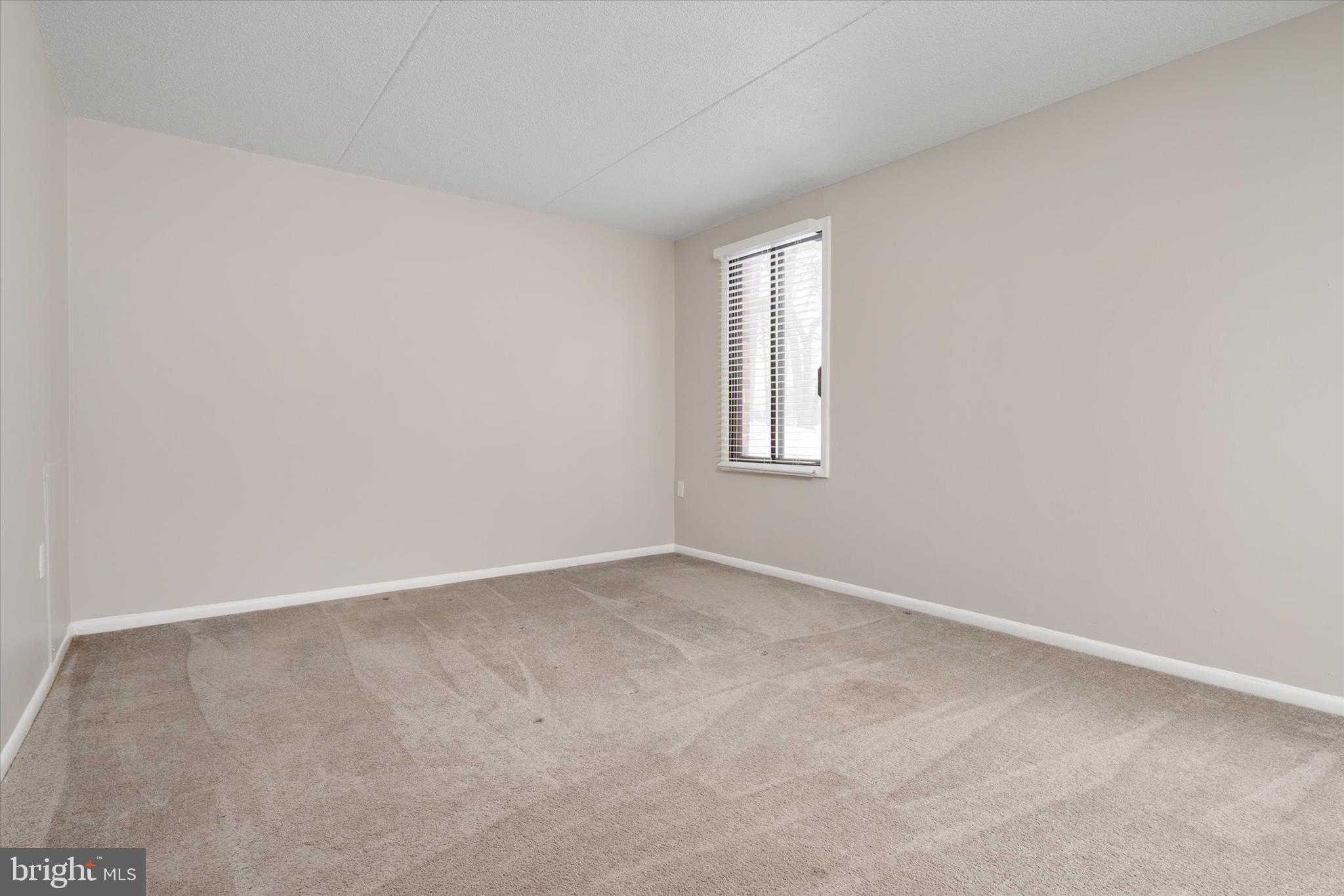 5245 West Running Brook Road, Unit 101 Columbia, MD 21044 - Photo 21 of 33 an empty room with windows