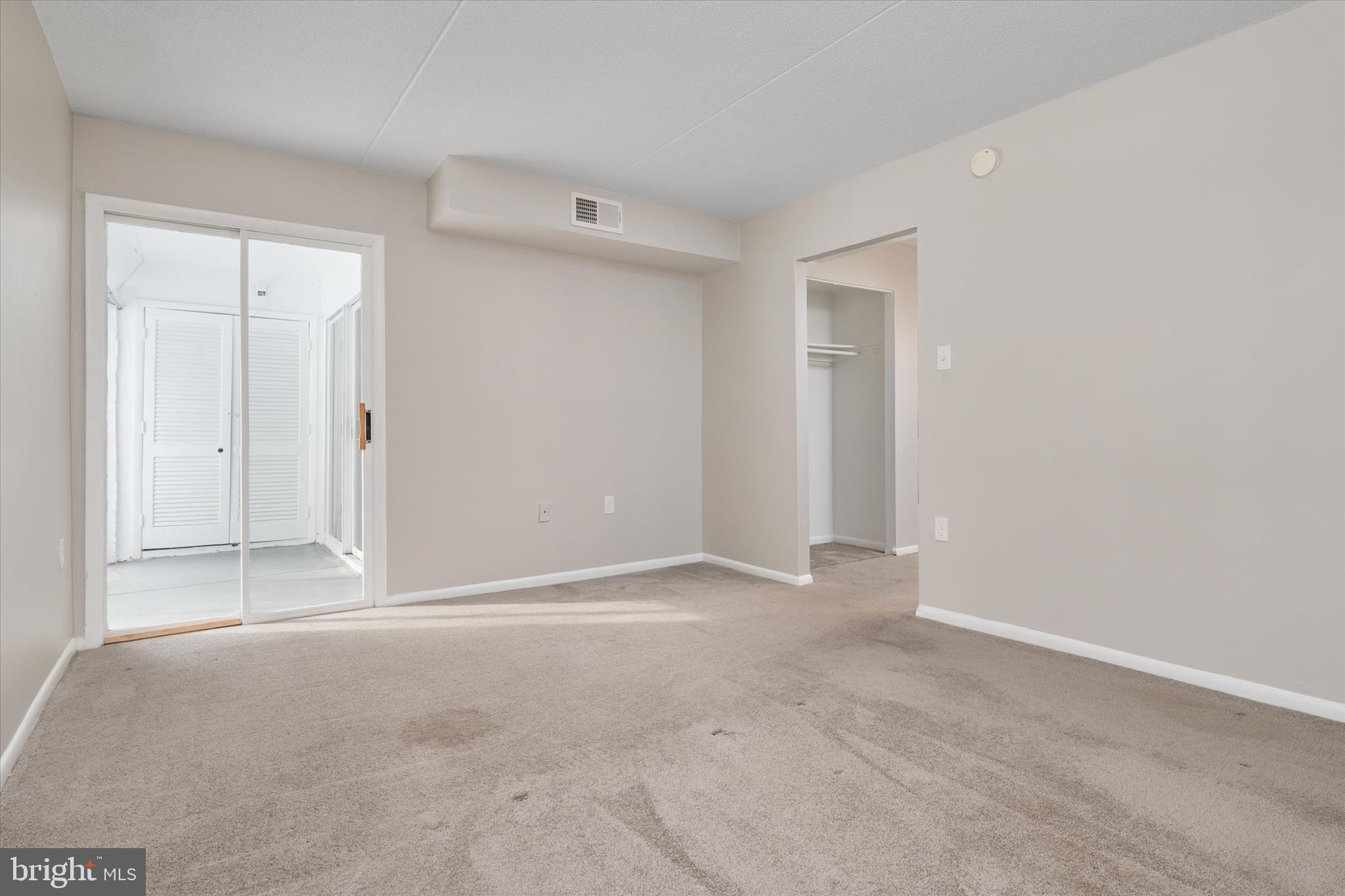 5245 West Running Brook Road, Unit 101 Columbia, MD 21044 - Photo 22 of 33 an empty room with windows and closet
