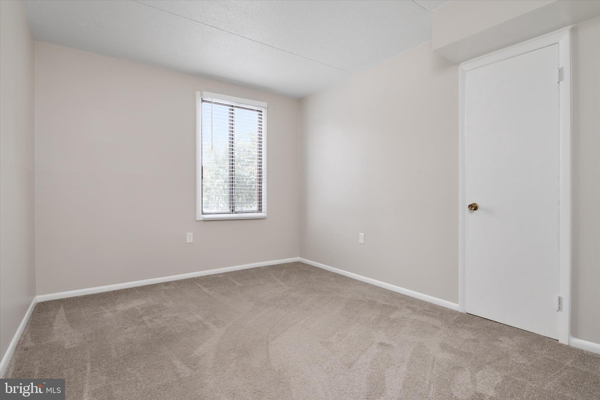 5245 West Running Brook Road, Unit 101 Columbia, MD 21044 - Photo 24 of 33 an empty room with windows