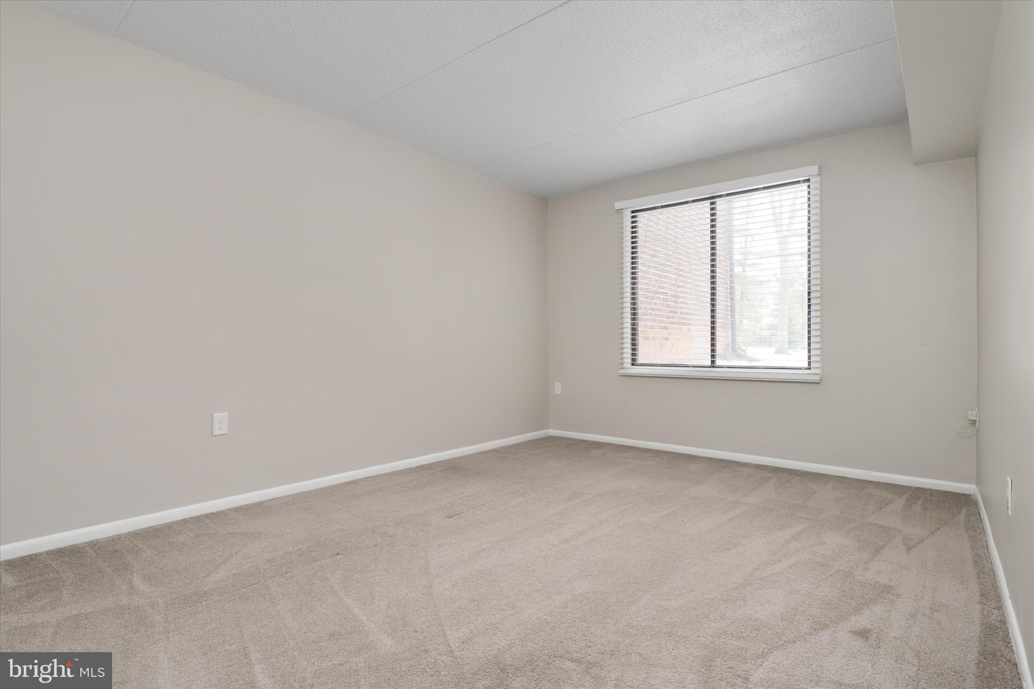 5245 West Running Brook Road, Unit 101 Columbia, MD 21044 - Photo 27 of 33 an empty room with windows