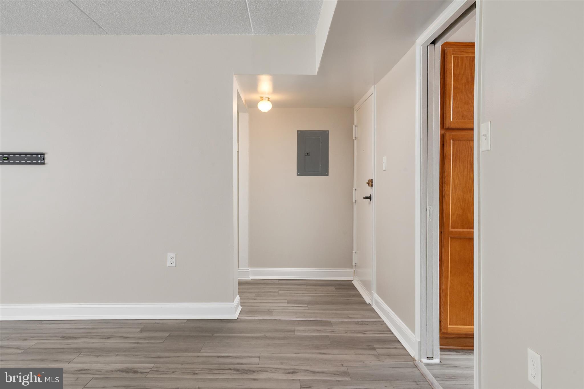 5245 West Running Brook Road, Unit 101 Columbia, MD 21044 - Photo 6 of 33 a view of a hallway with wooden floor