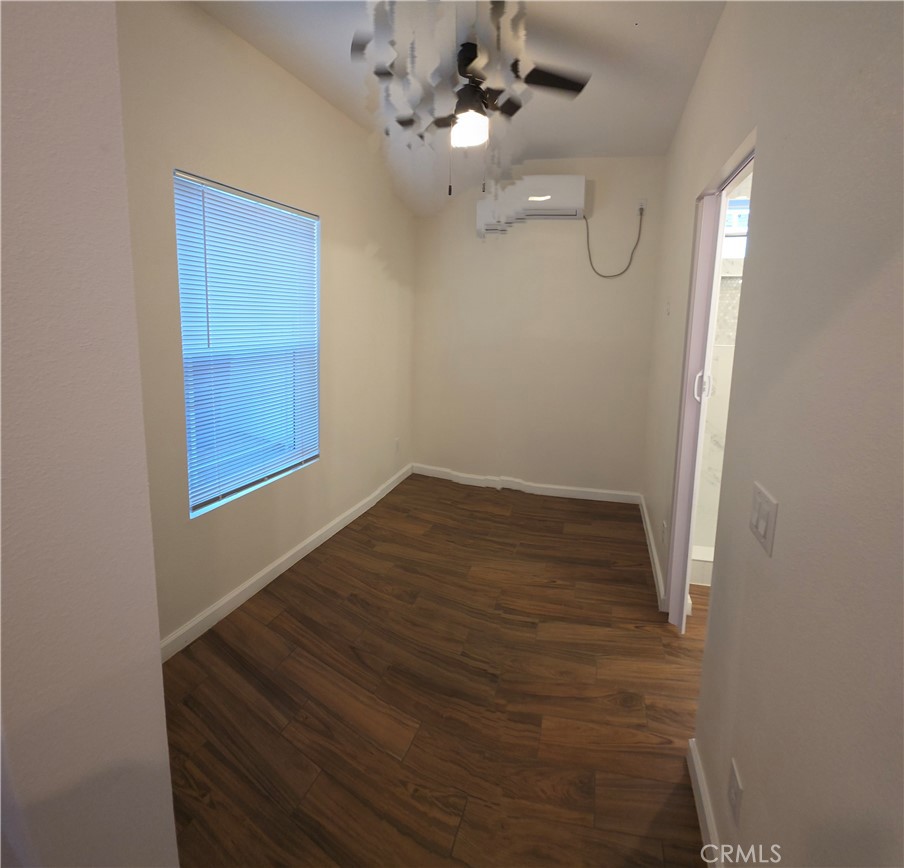 1496 Powell Riverside, CA 92501 - Photo 4 of 7 wooden floor in an empty room with a window