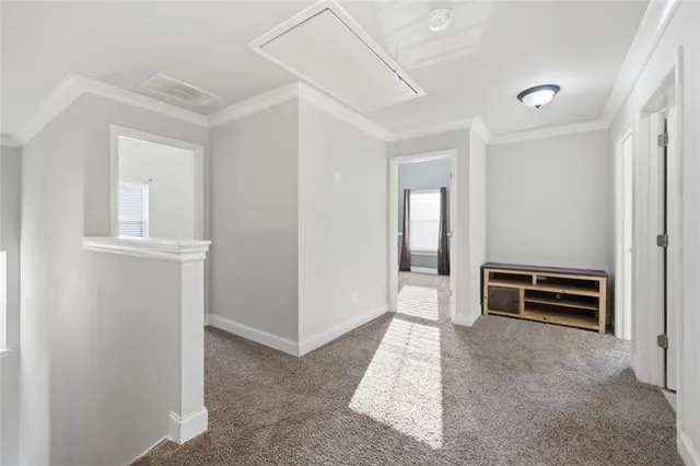 a view of a livingroom with furniture and a ceiling fan