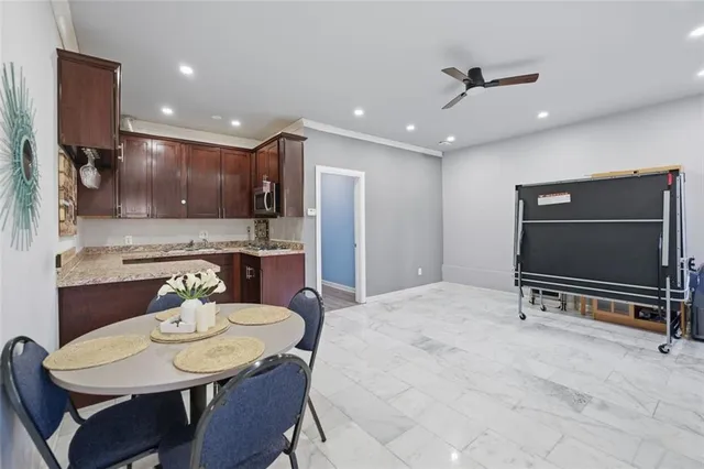a kitchen with a refrigerator and a sink