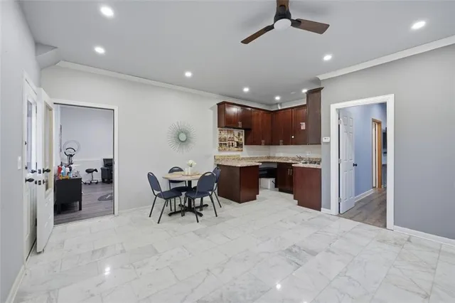 a kitchen with a sink a stove and cabinets