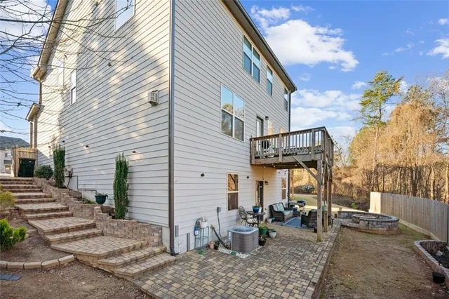 a view of a backyard with chairs