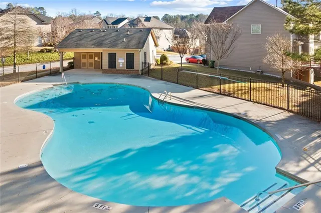 a view of a swimming pool with a sitting area