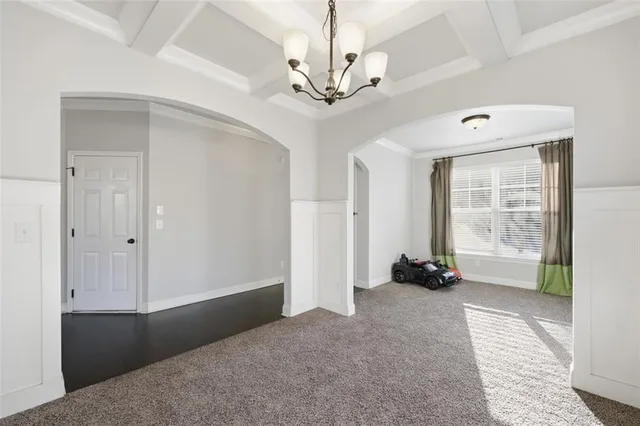 a view of a room with window and a ceiling fan