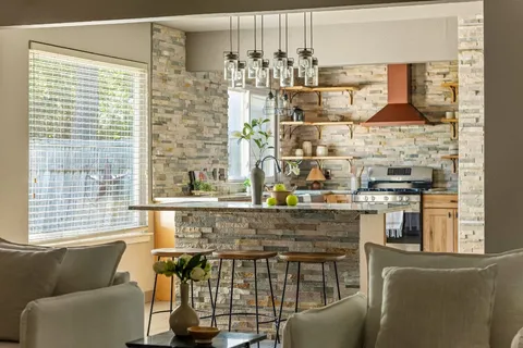 a kitchen with a window and cabinets