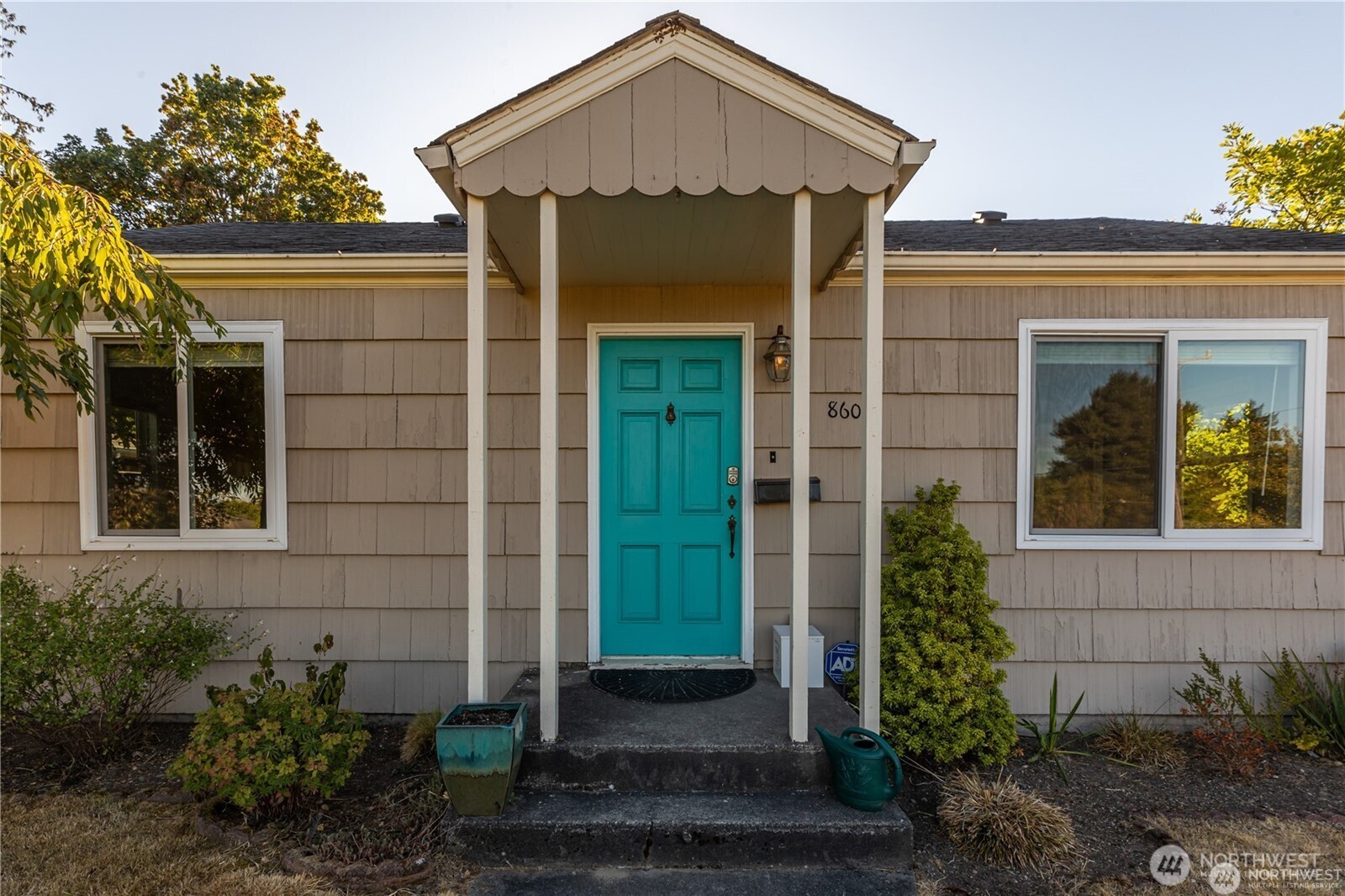 8601 36th Avenue Southwest Seattle, WA 98126 - Photo 3 of 28 a front view of a house with garden