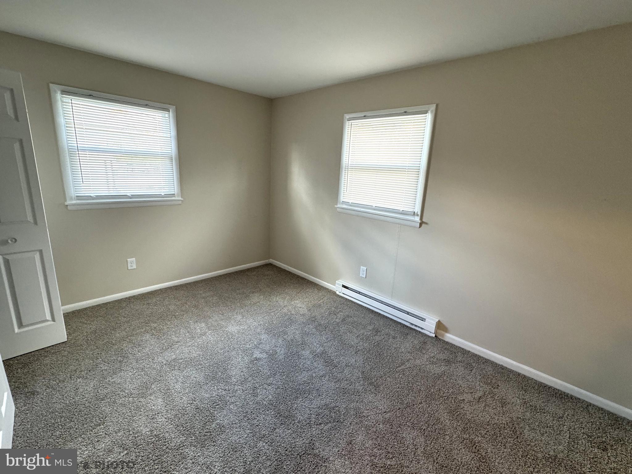 6570 Somerset Street, Unit 2 Harrisburg, PA 17111 - Photo 4 of 9 an empty room with a window
