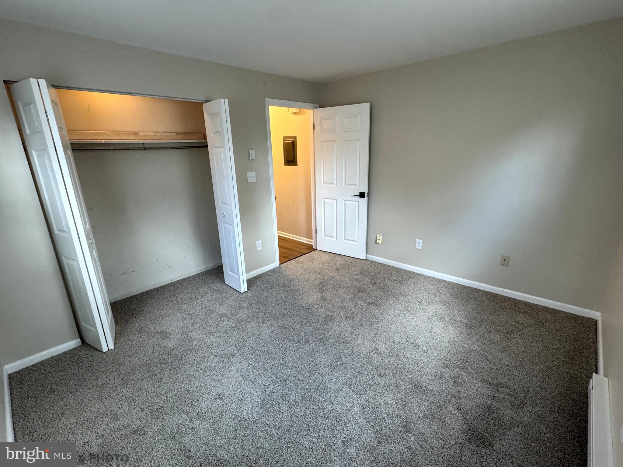 6570 Somerset Street, Unit 2 Harrisburg, PA 17111 - Photo 7 of 9 an empty room with closet and wooden floor