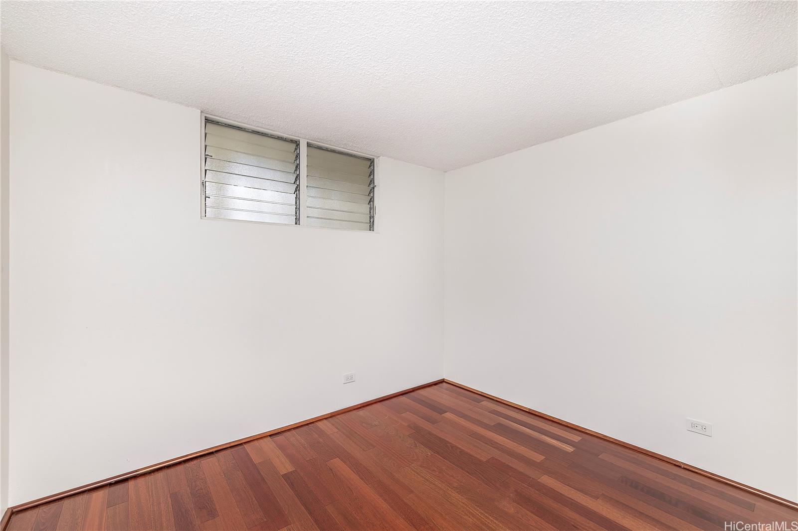 469 Ena Road, Unit 2205 Honolulu, HI 96815 - Photo 11 of 21 a view of empty room with wooden floor