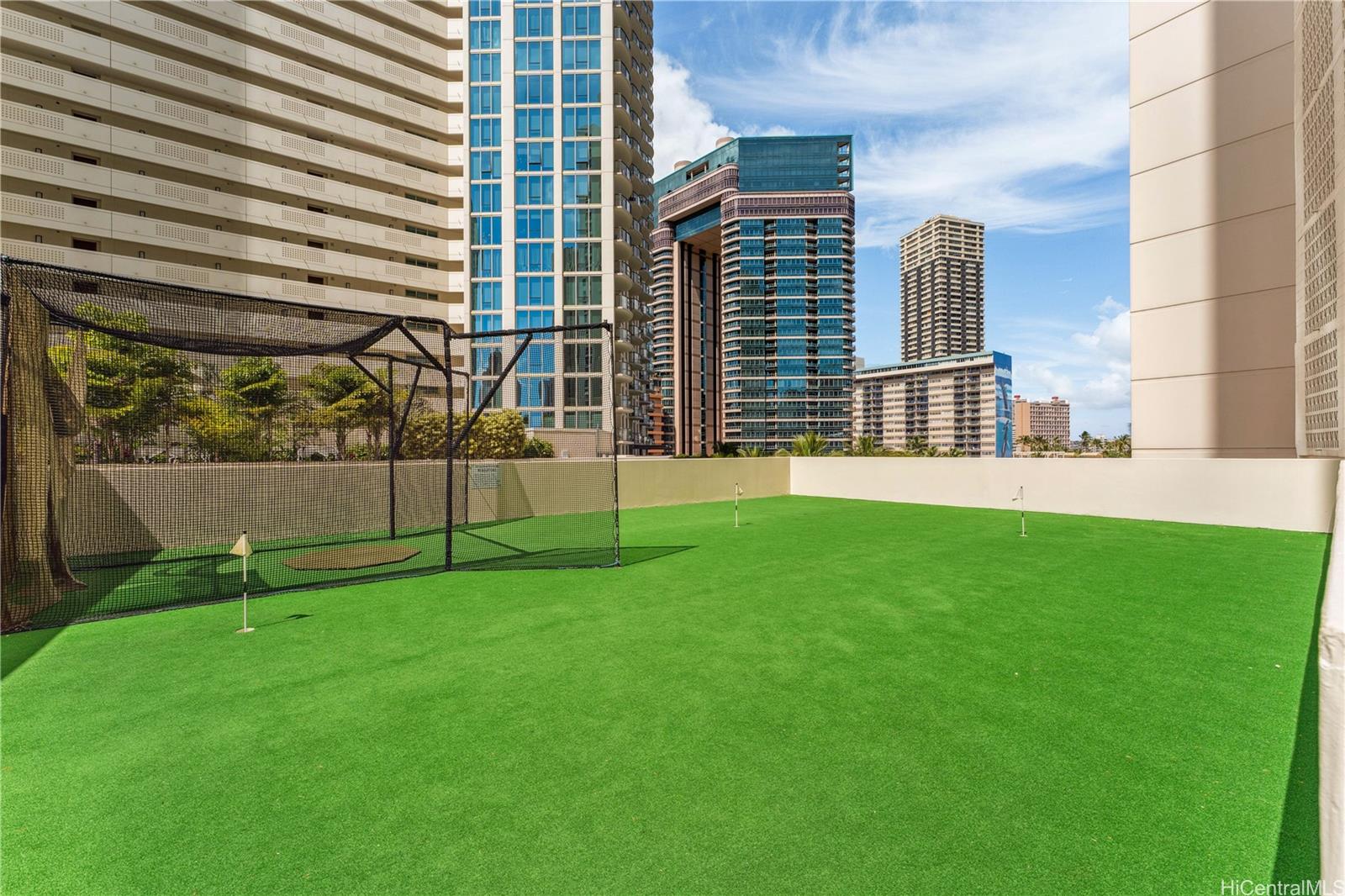 469 Ena Road, Unit 2205 Honolulu, HI 96815 - Photo 16 of 21 a view of a house with a backyard