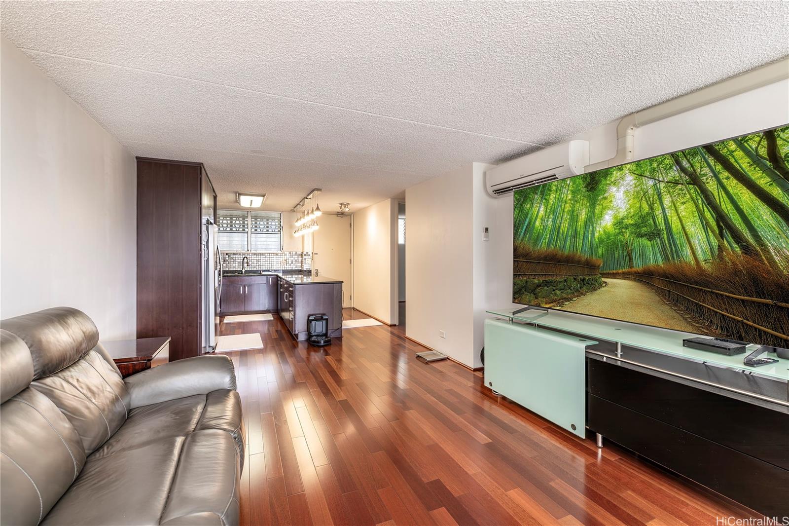 469 Ena Road, Unit 2205 Honolulu, HI 96815 - Photo 3 of 21 a living room with furniture and a large window