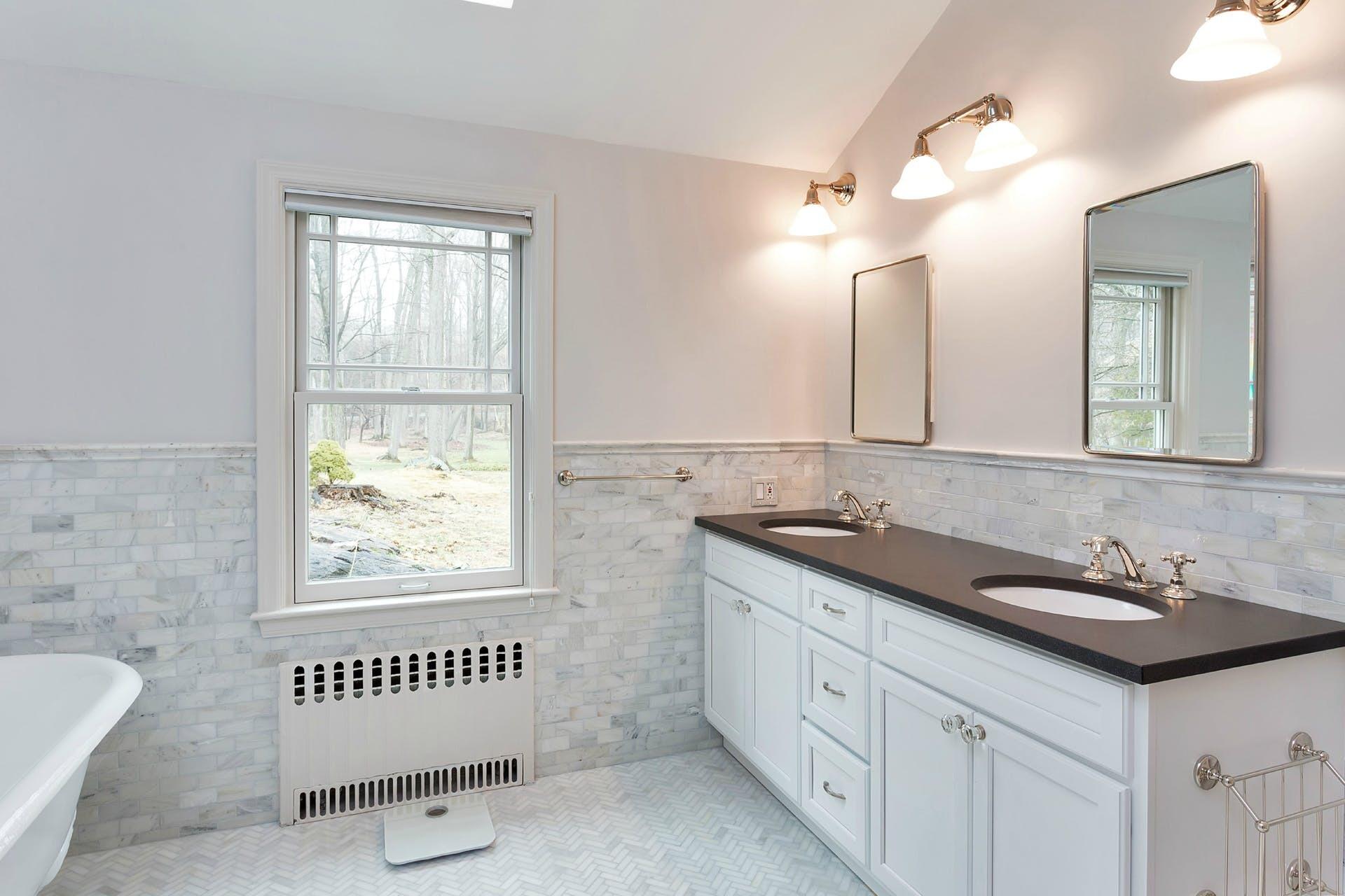 337 Brookside Road Darien, CT 06820 - Photo 15 of 35 a bathroom with a sink and a mirror
