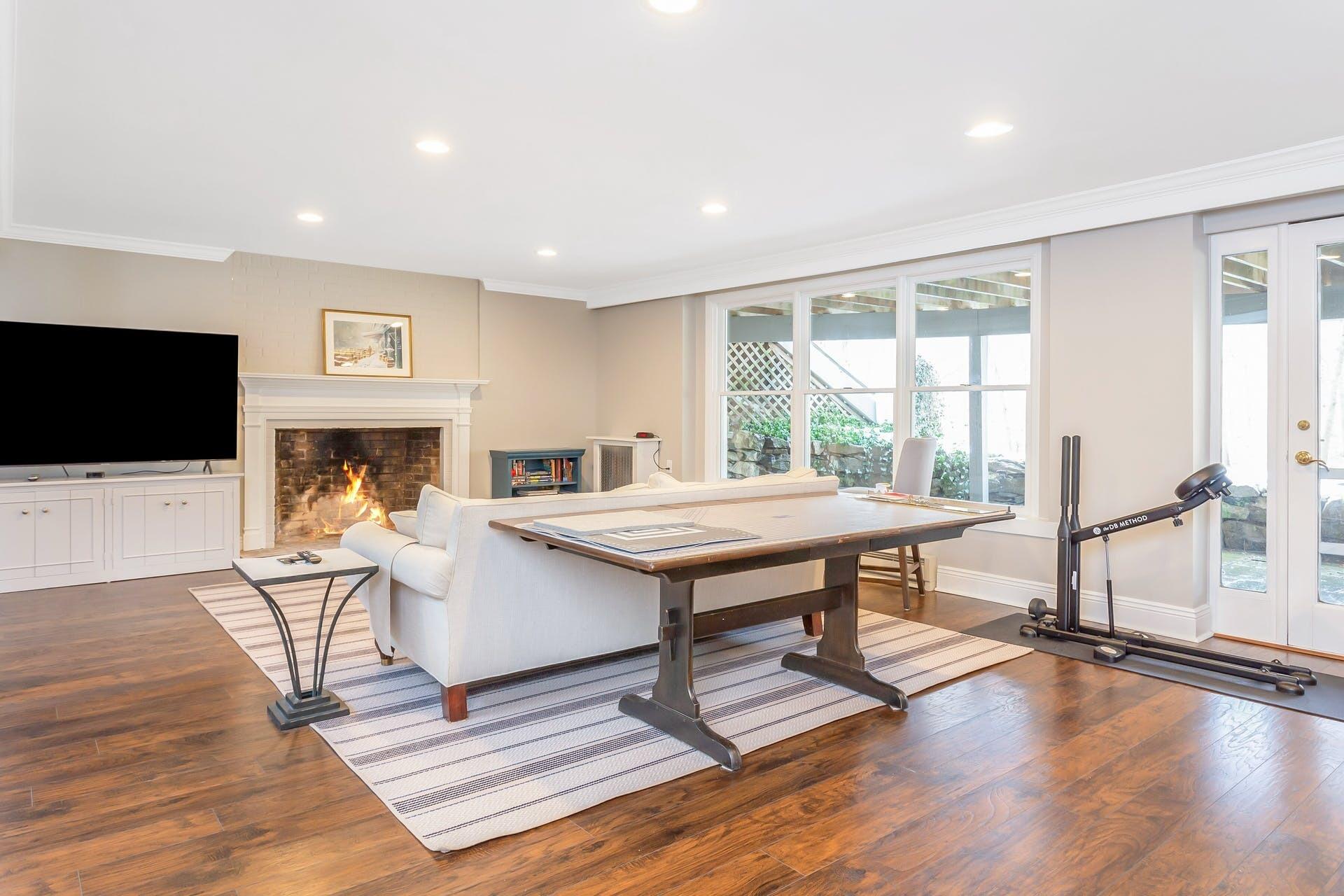 337 Brookside Road Darien, CT 06820 - Photo 21 of 35 a living room with furniture a flat screen tv and a fireplace