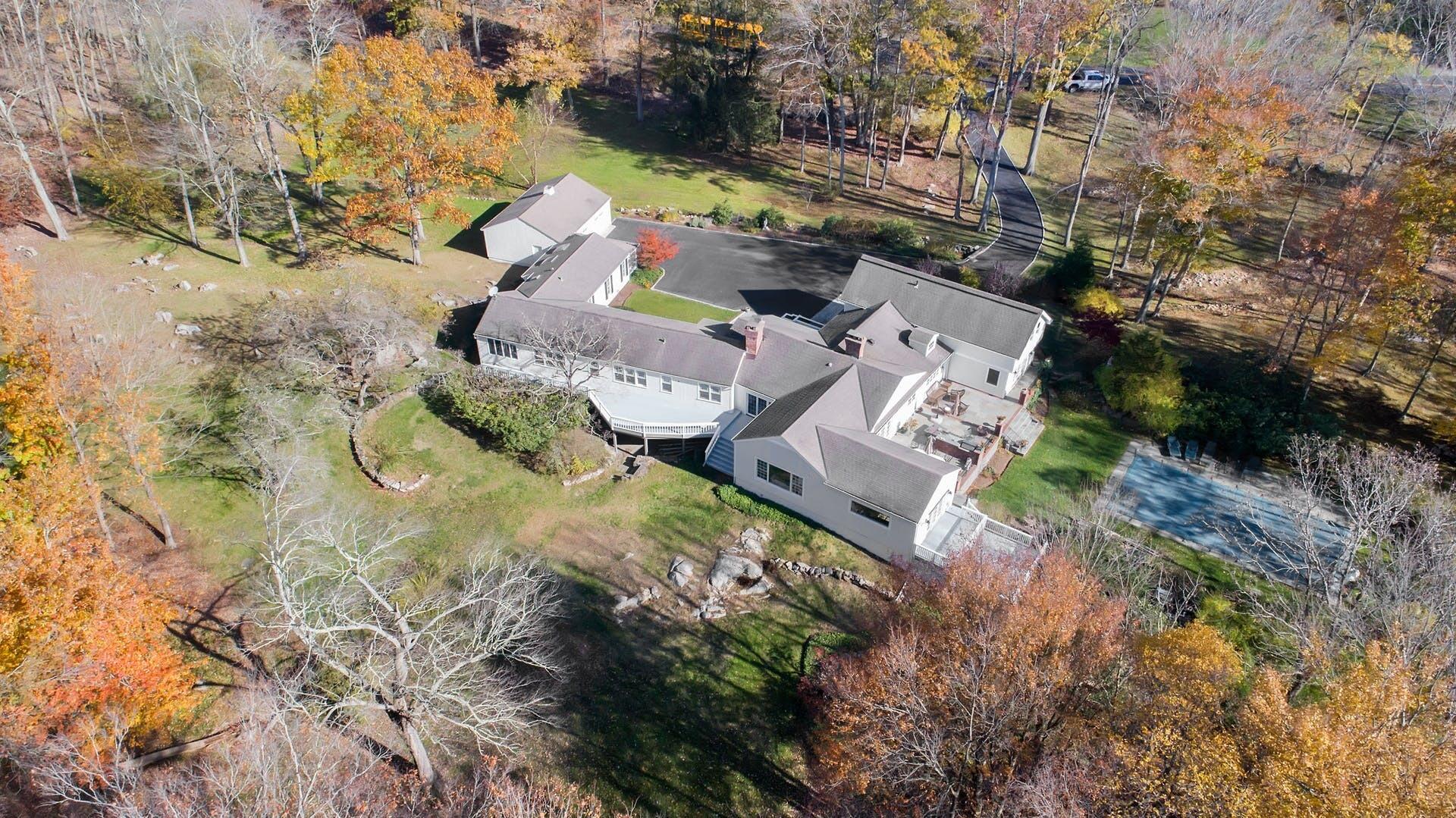 337 Brookside Road Darien, CT 06820 - Photo 25 of 35 an aerial view of a house with a yard