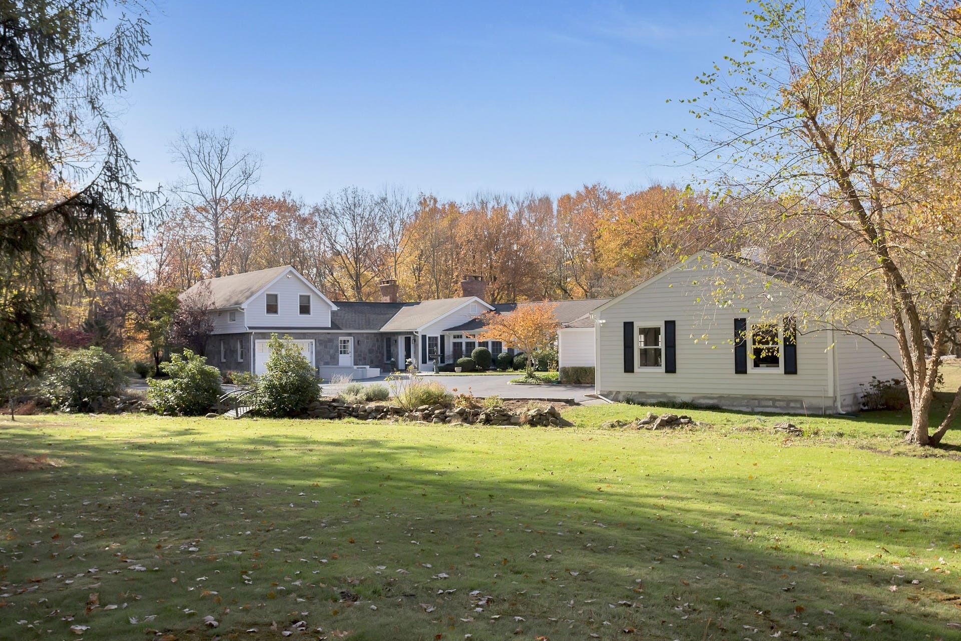 337 Brookside Road Darien, CT 06820 - Photo 27 of 35 a view of a house with a yard