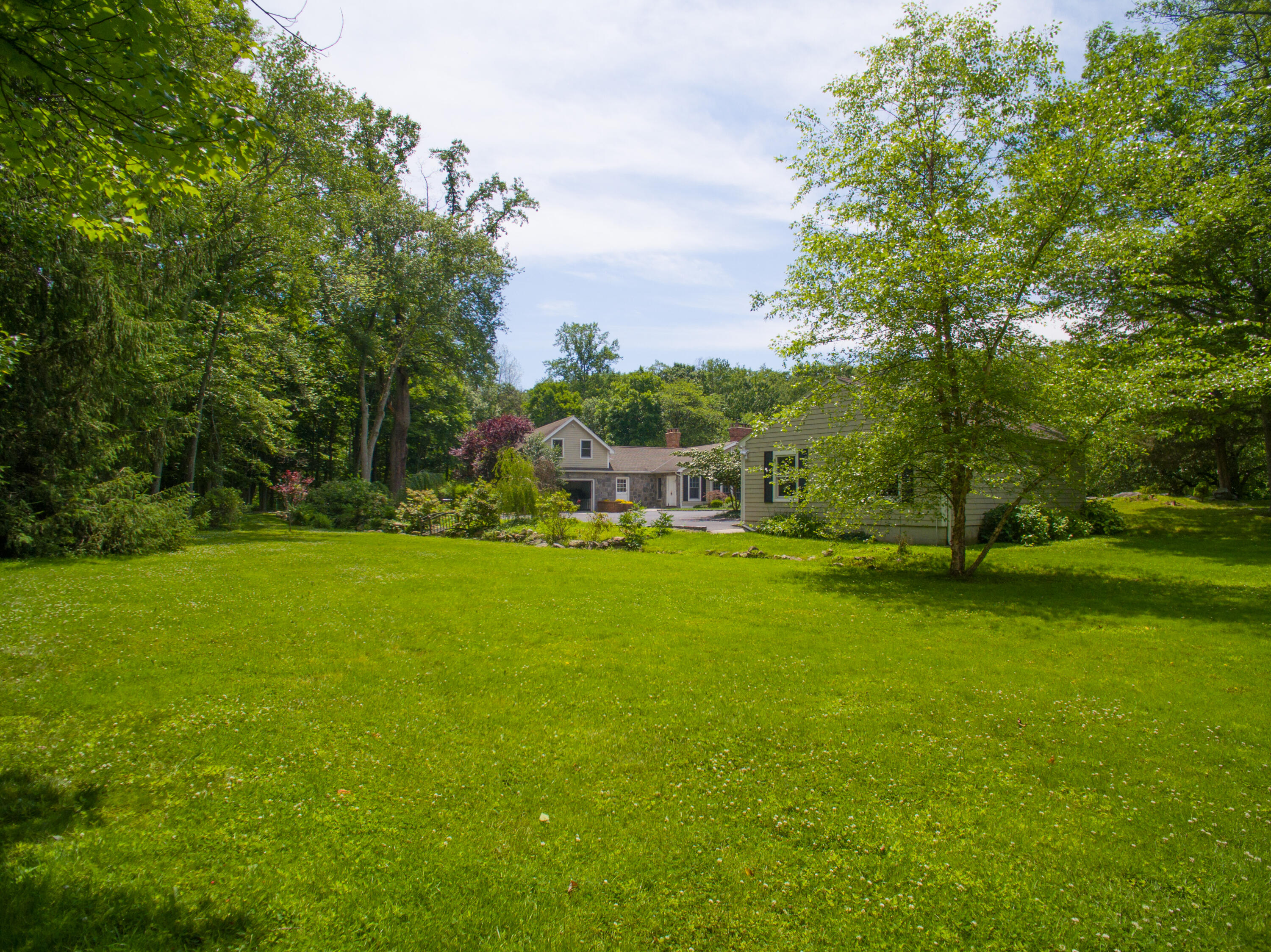337 Brookside Road Darien, CT 06820 - Photo 28 of 35 a view of a house with a big yard