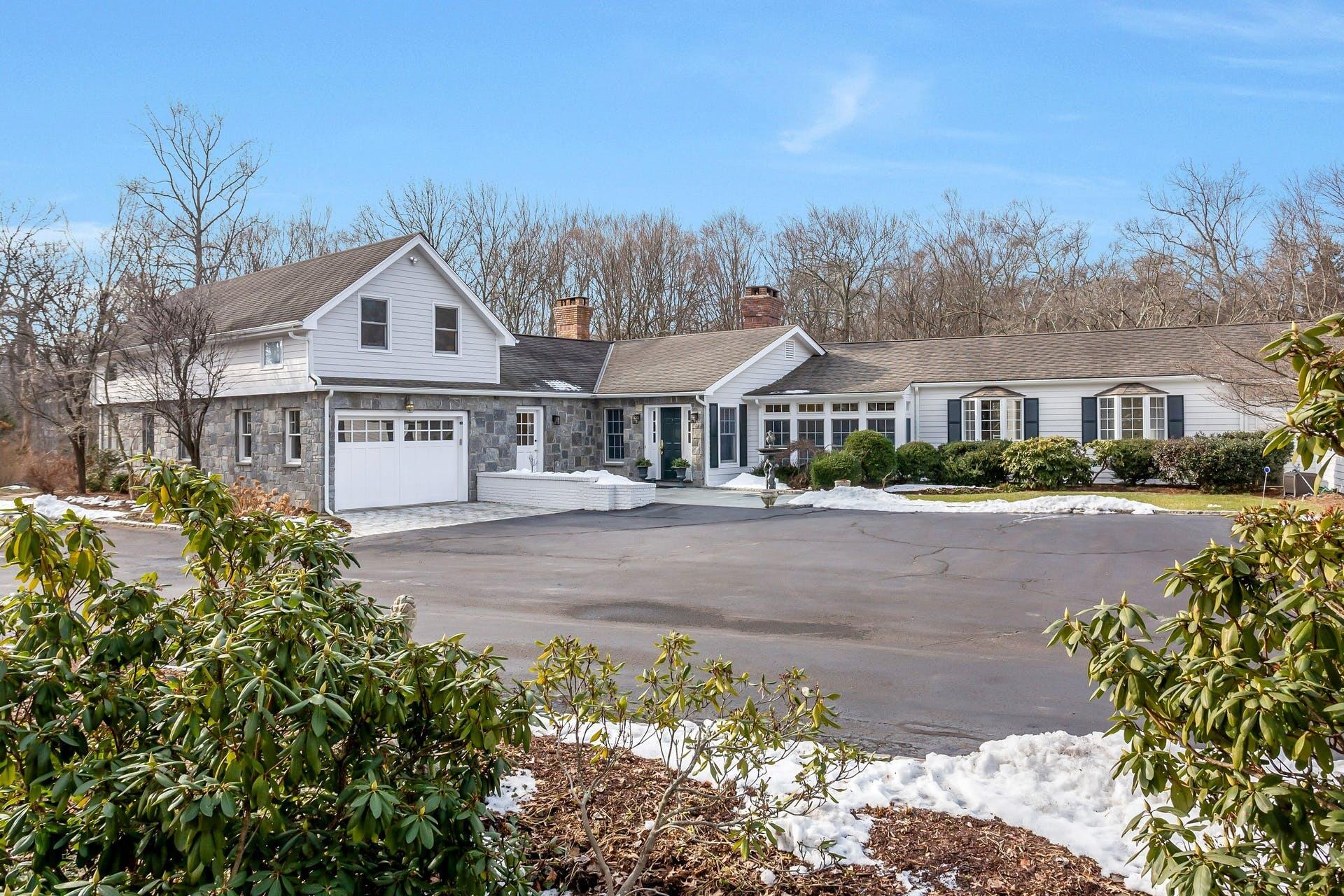 337 Brookside Road Darien, CT 06820 - Photo 31 of 35 a front view of a house with a yard