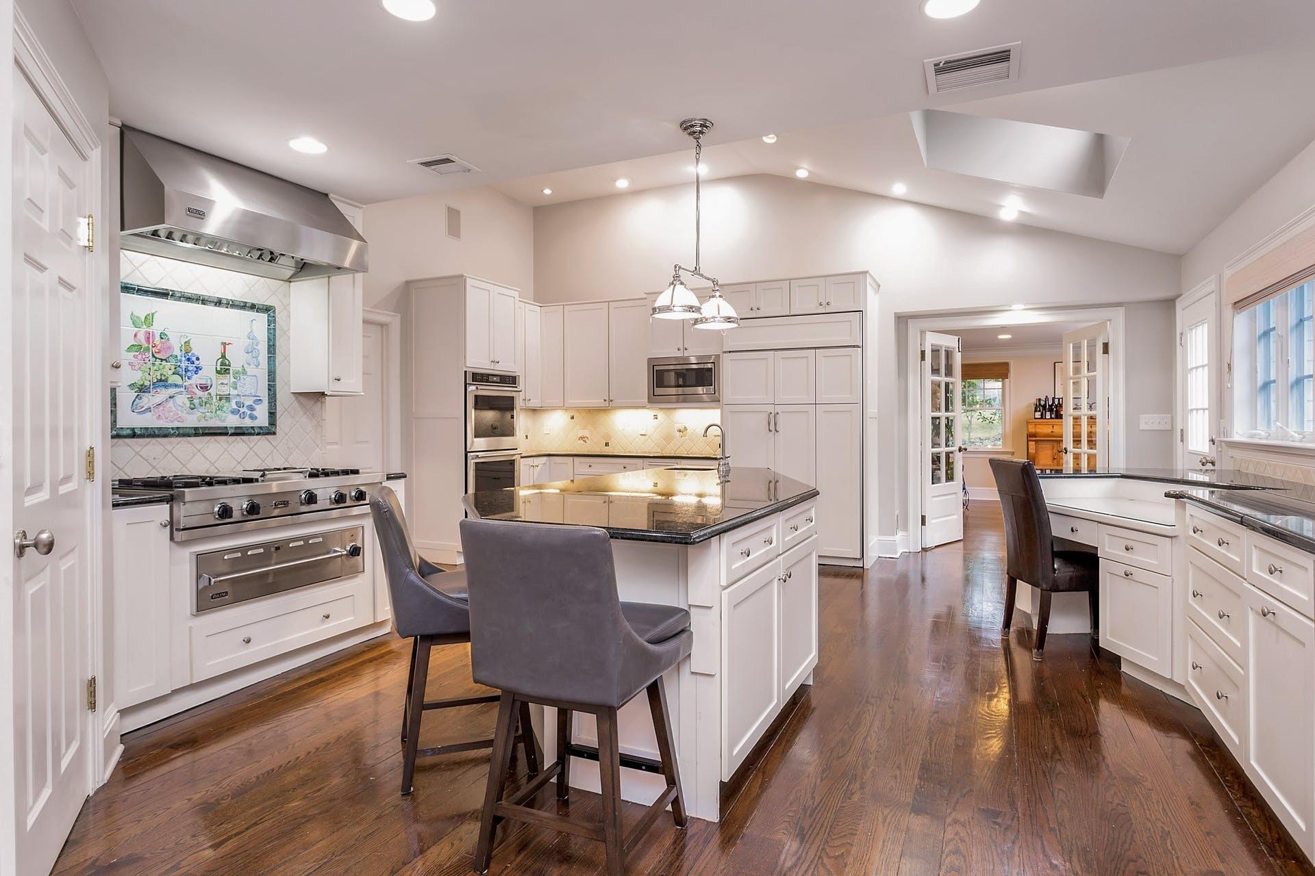 337 Brookside Road Darien, CT 06820 - Photo 5 of 35 a kitchen with stainless steel appliances kitchen island granite countertop a kitchen island hardwood floor and a sink