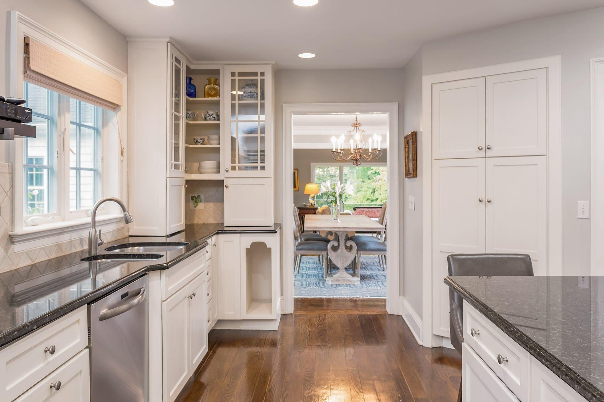 337 Brookside Road Darien, CT 06820 - Photo 6 of 35 a kitchen with a sink stove and cabinets