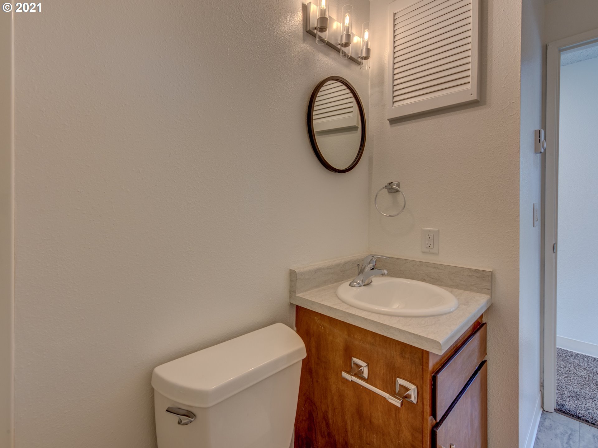 4850 Jessen Drive Eugene, OR 97402 - Photo 17 of 22 a bathroom with a sink and a mirror